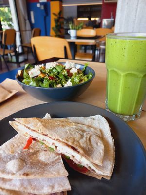 Cheese pockets, gourmet salad and green smoothie. at Veganaki in Athens