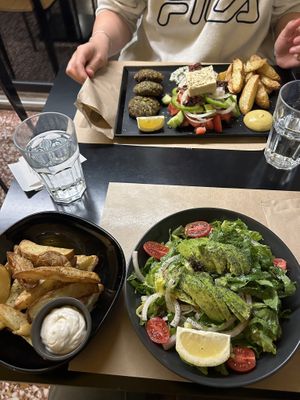 Avocado salad and fries and the Veganaki special   at Veganaki in Athens