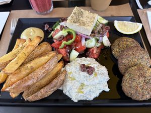 The Veganaki special, with mung bean patties, salad, homemade tzatziki, and air fried potatoes  at Veganaki in Athens