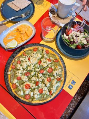 Gluten free pizza and Greek salad. at Veganaki in Athens