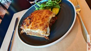 Moussaka : Vegan twist on the traditional dish, made with eggplant,
potatoes, red lentil “mince,” and a creamy béchamel
sauce from cauliflower and almond milk. at Veganaki in Athens