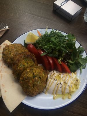 vegan burger with salad, mustard, yoghurt sauce, salad and pita bread  at Veganaki in Athens