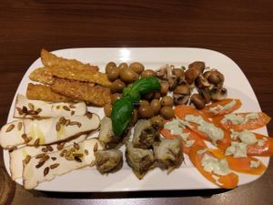 Antipasti with marinated tempeh, artichoke, carrots, tofu, olives. at La Stella Nera in Berlin