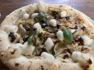 Carciofina piccante: a beautifully assembled white pizza  at La Stella Nera in Berlin