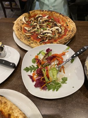 Big salat and Pizza funghi  at La Stella Nera in Berlin
