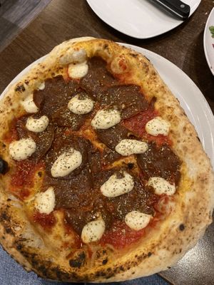 Pizza with spicy sauce and homemade cheesee  at La Stella Nera in Berlin