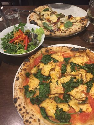Delicious pizzas and salad from La Stella Nera at La Stella Nera in Berlin