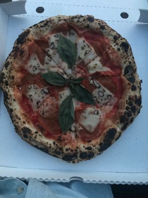 salame pizza rossa: tomato sauce, vegan cheese, vegan salami, fresh basil at La Stella Nera in Berlin