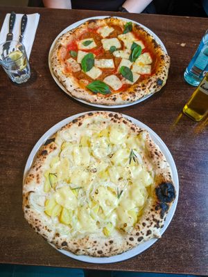 Patate e Cipolle pizza and Salame pizza at La Stella Nera at La Stella Nera in Berlin