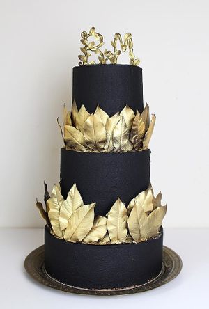 Vegan French mousse cake: red velvet cake, almond dacquoise, white chocolate based mousse, cherry cremeux, joghurt mousse.
Decorations: White chocolate velvet (in black color), white chocolate leaves & topper with edible gold. at Physalis in Warsaw