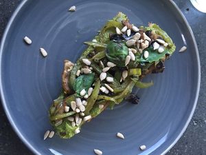 Toast with a green spread and sautéed vegetable at Joe's Place in Pico