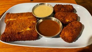 Two orders in this picture: the Katsu tofu steak, and the large tater tots. Both were really delicious. at Obon Shokudo in Portland