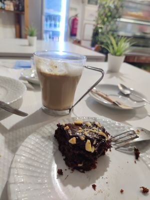 Coffee with soy milk and cake, great combo at Veganeats Caffe in Lisbon