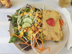 Alheira gratin with salad and half a strawberry (???) at Veganeats Caffe in Lisbon