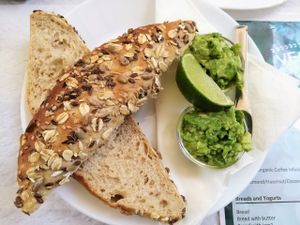 Avocado, lime and cereal bread. at Veganeats Caffe in Lisbon