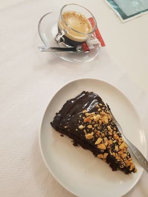Chocolate cake and Coffee   at Veganeats Caffe in Lisbon