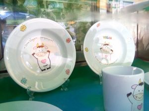 Happy cows at the entrance at Veganeats Caffe in Lisbon