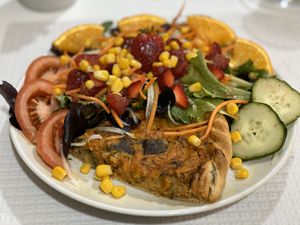 Quiche with salad at Veganeats Caffe in Lisbon