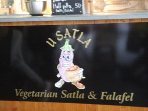 Cute eggplant mascot for U Satla at U Satla in Prague