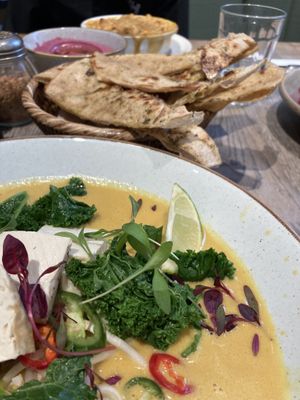 Mac ‘n’ cheese (in the back), beetroot hummus with flatbread, and coconut curry.  at Farmacy in West London
