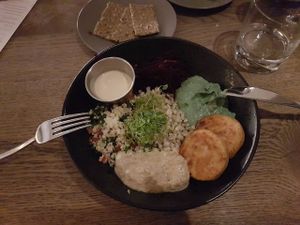 Middle Eastern Bowl with a bunch of different flavours plus zahatar crackers in the background :D at Farmacy in West London