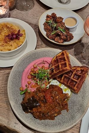 Falafel waffles with aubergine sambal, beetroot hummus & cucumber yoghurt raita at Farmacy in West London
