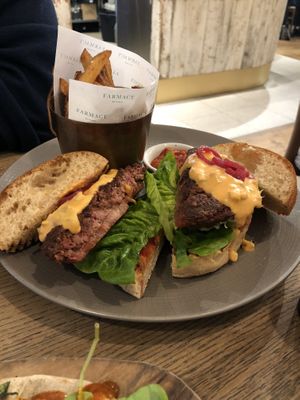 Burger with homemade fries at Farmacy in West London