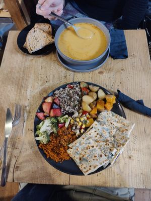 Spinache and onion flatbread meal with salad next to the soup at Organico in Epsom