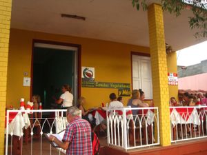 Restaurant from the outside. There are one or two tables inside. at La Berenjena in Vinales