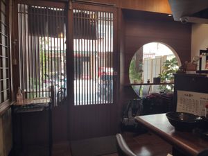 Sitting at the counter, looking outside at Qiu Dou Ru La Mien - Hagi Soymilk Ramen in Kaohsiung