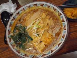 Spicy soy milk ramen (rich broth) with kimchi on the side at Qiu Dou Ru La Mien - Hagi Soymilk Ramen in Kaohsiung