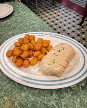 Straight Up Breakfast Burrito with all the Sauces and Tots at The Tasty in Philadelphia