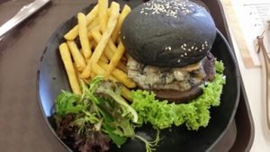 Swiss mushroom charcoal burger  at GroVe in Central Singapore