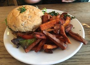 Burger with Sweet Potato Fries and Salad  at Cafe Kino in Bristol