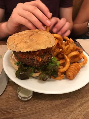 Spicy burger with curly fries at Cafe Kino in Bristol