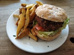 Satay burger and sliced chips at Cafe Kino in Bristol