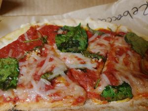 Spinach, basil, garlic, vegan cheese, vegan garlic butter drizzle at Dells Pizza Lab in Wisconsin Dells