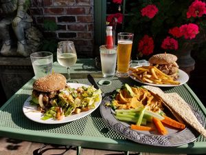 Burger, fries, salad and half eaten hummus at The Dancing Fox in Lodi