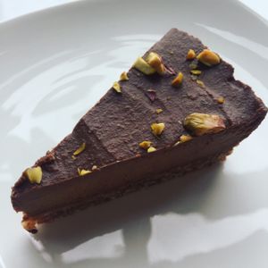 chocolate and chaga cake sprinkled with pistachios  at Juice Warrior in Edinburgh