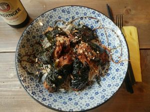 Basil wrapped seitan over noodles and herb salad. at Soya in Berlin
