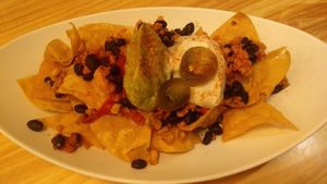 Totopos con frijoles negros, guacamole y crema agria at La Huella Vegana in Rivas-vaciamadrid