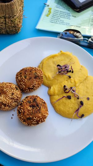 Chiftele with polenta (mămăliga) at Vyro Raw & Vegan Bistro in Bucharest