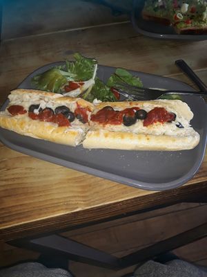 Vegan Mozzarella cheese, tomato & black olive pannie. at Super Natural Newcastle in Newcastle Upon Tyne