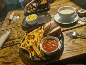 Pretzel brunch burger again ^^ and the sausage mushroom and bacon roll. With a side of scrambled tofu ❤️❤️❤️ at Super Natural Newcastle in Newcastle Upon Tyne