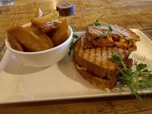 Tomatoe, Motzarella & Pesto Toasted Sandwich with crunchy chips. at Super Natural Newcastle in Newcastle Upon Tyne
