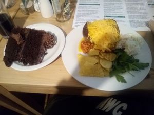 Chocolate cake & jacket potato with vegan cheese and beans. X x x at Super Natural Newcastle in Newcastle Upon Tyne