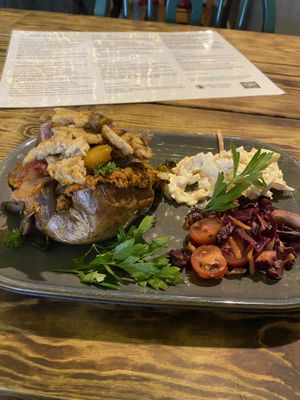 Jacket Potato with roasted veg, hummus. Added extra vegan chicken. Yum! at Super Natural Newcastle in Newcastle Upon Tyne