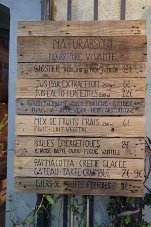 Wooden sign-boards outside the restaurant at Naturabsolu in Villeneuve-les-avignon