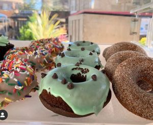 Mint chocolate chip, apple cider and birthday cake donuts. All gluten free and vegan  at Sinful Confections in Portland