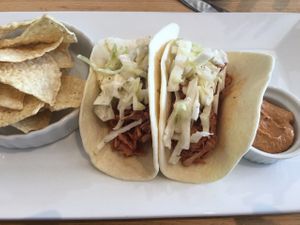 BBQ jackfruit tacos with chips and chili "cheese" dip at Root in Wilmington